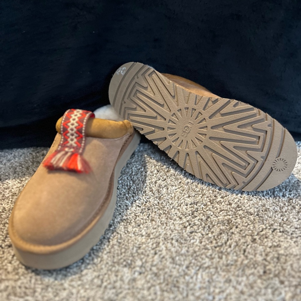 UGG Stylish Brown Slip-On Shoes with Red Tassel